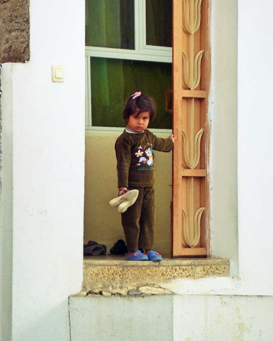 Little girl at a door in Amadiya