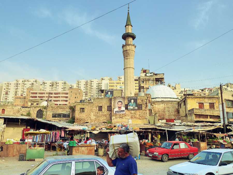 Man walking through a market in Tripoli, Lebanon