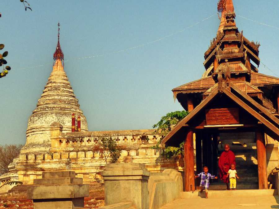 Child monk and Children leave a temple in Bagan