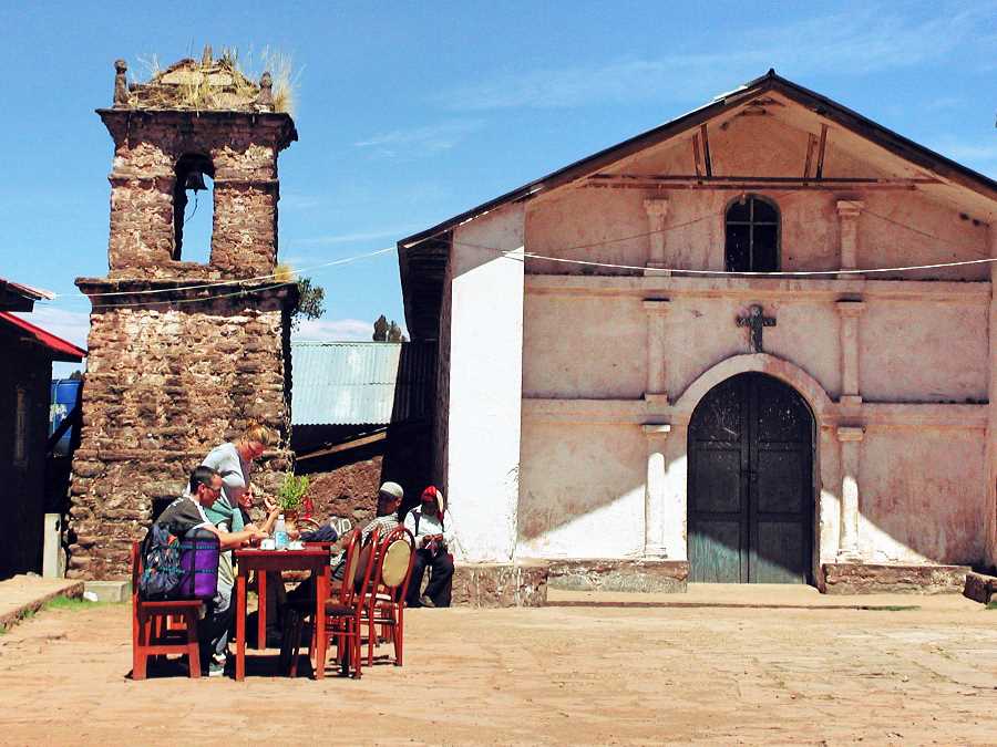 Dining beside the church. Lake Titicaca, Peru