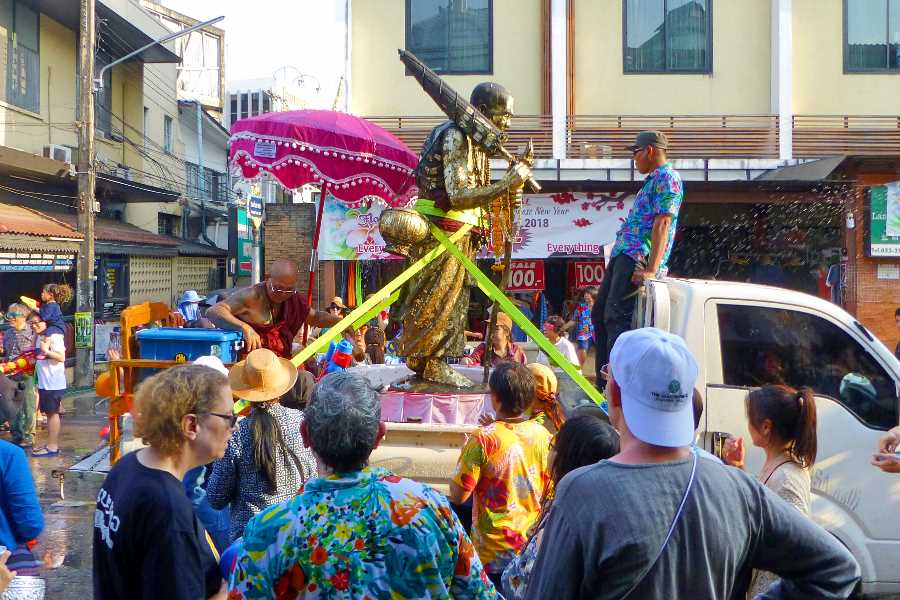 A monk takes part in the Songkran parade