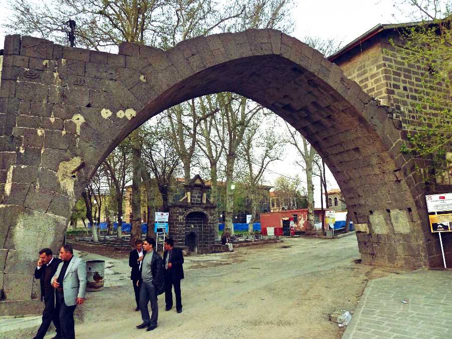 Men Walking Under An Arch in Diyarbakir