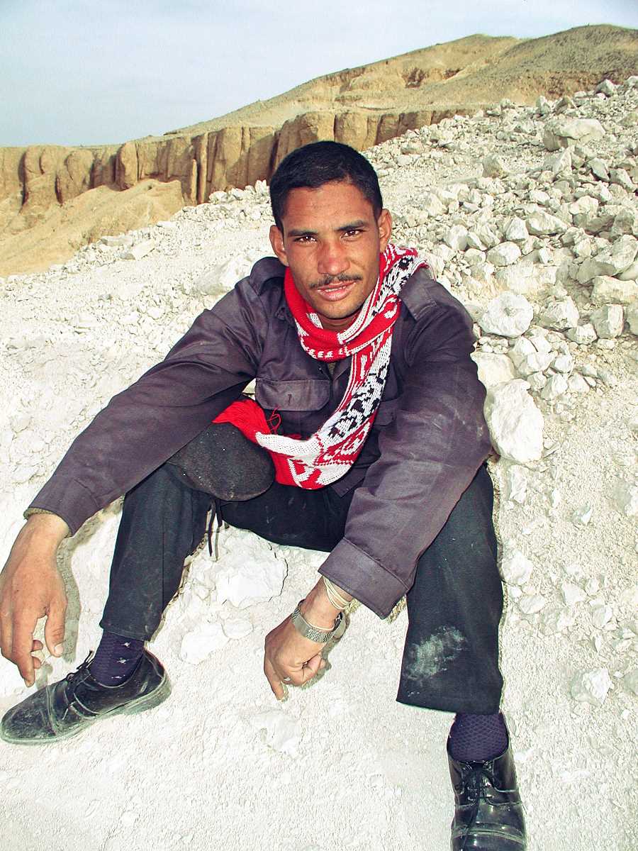 Security guard with football scarf poses at the Valley of the Kings in Luxor, Egypt