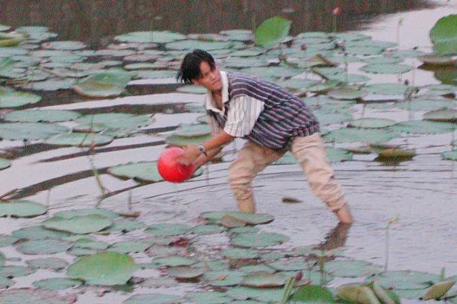 Retrieving the ball out from the moat of the Hue Citadel