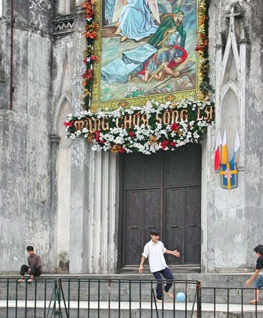 Playing football in front of the Catholic Church in Sapa