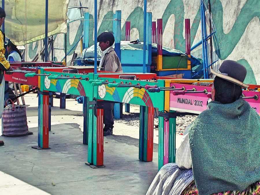 Bolivian woman watching table football
