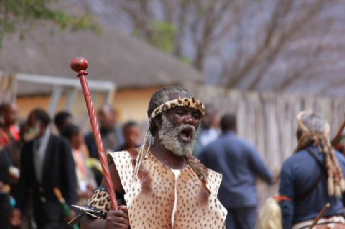 The Zulu King’s Press Secretary shouts the good virtues and accomplishments of the King.