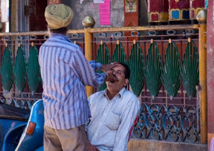 A denture (false teeth) repair man in McLeod Ganj, India.
