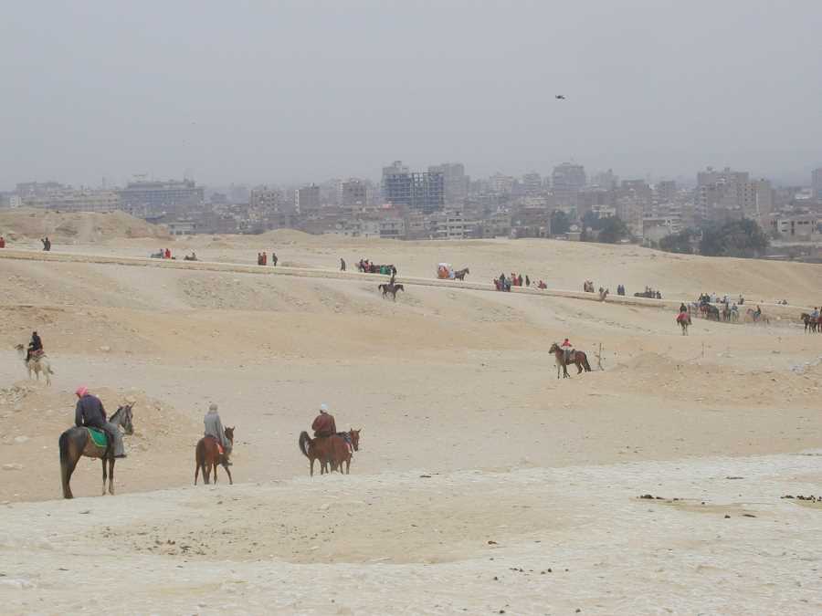 The suburbs of Cairo encroach on the Pyramids